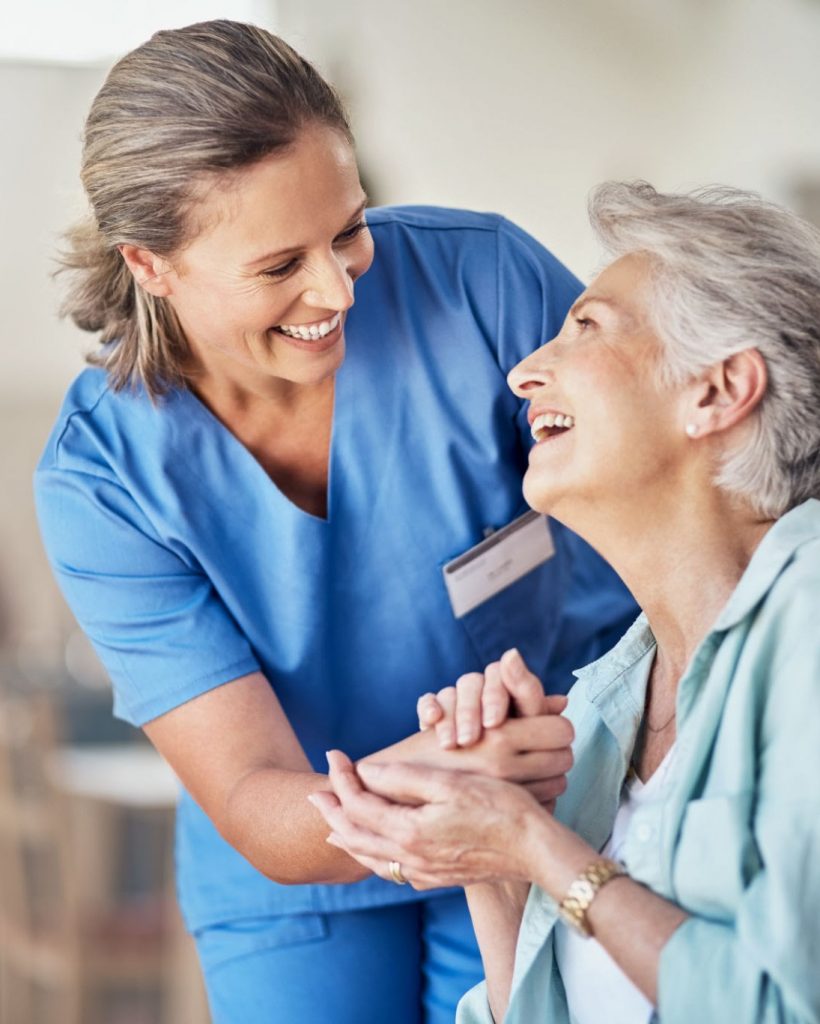 caregiver is holding the client's hand